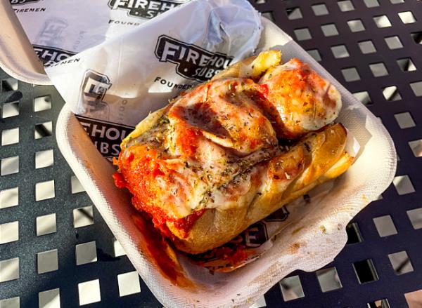 a meatball sub in a takeout co<em></em>ntainer from firehouse subs