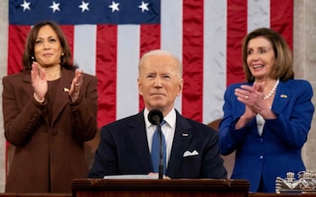 Biden delivers an address flanked by Kamala Harris and Pelosi