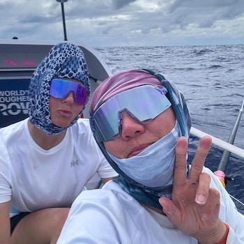 Two women on a boat, wearing wrap-around sunglasses