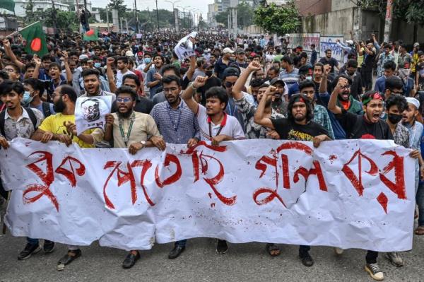 Students shout slogans during a protest march