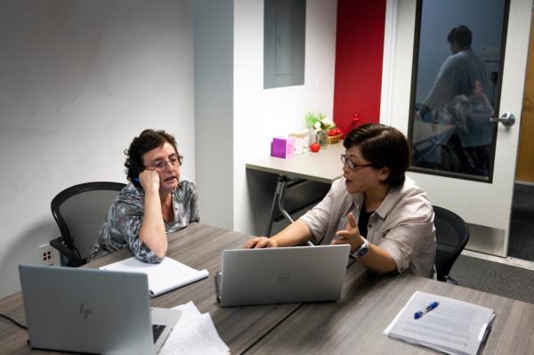 College professors are grappling with how to limit their students from utilizing ChatGPT. The above image shows Robin Kolodny (left), a political science professor, and Eunsook Ha Rhee, an associate professor of instruction, during a faculty teaching circle on artificial intelligence at Temple University in Philadelphia on Wednesday. 