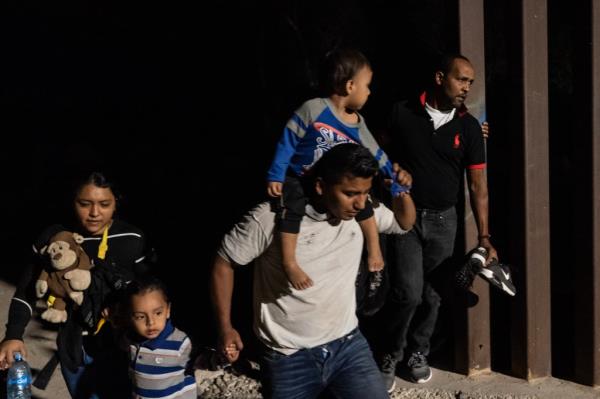 A migrant family walking toward the border near Yuma on August 4, 2023.