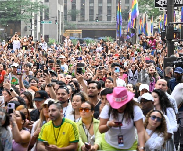 Thousands of fans gather to catch a glimpse of Karol G perfom at Rockefeller.