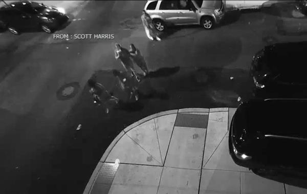 A security camera outside Harris' apartment captured a group of good samaritans walking Harris and Nora back to his home after the attack, wher<em></em>e his partner was waiting for him. 