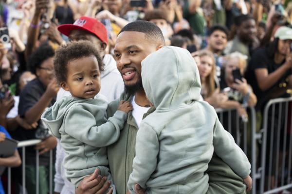 MILWAUKEE, WISCo<em></em>nSIN - SEPTEMBER 30: Damian Lillard walks with his kids during a welcome rally at Fiserv Forum on September 30, 2023 in Milwaukee, Wisconsin. NOTE TO USER: User expressly acknowledges and agrees that, by downloading and or using this photograph, User is co<em></em>nsenting to the terms and co<em></em>nditions of the Getty Images License Agreement. (Photo by Patrick McDermott/Getty Images)
