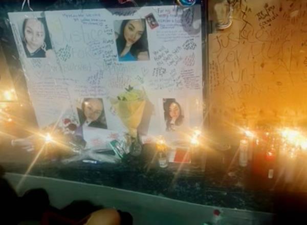 Candles burn in makeshift memorial outside Dolaj Astoria nightclub for Stephanie Quinones. She died there.