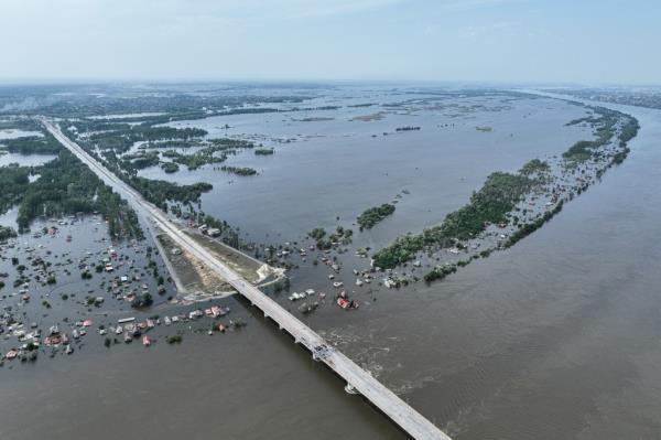 Houses are seen underwater in the flooded village near Kherson, Ukraine, Saturday, June 10.