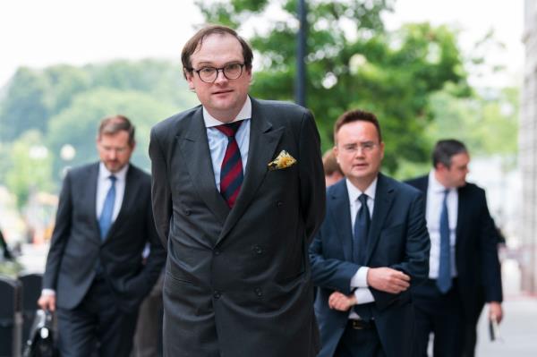 Samuel Dewey representing the co<em></em>nservative think tank The Heritage Foundation, center, and Nile Gardiner, director of the Margaret Thatcher Center for Freedom at The Heritage Foundation, right, walk to speak to reporters outside the federal courthouse in Washington, Tuesday, June 6, 2023.