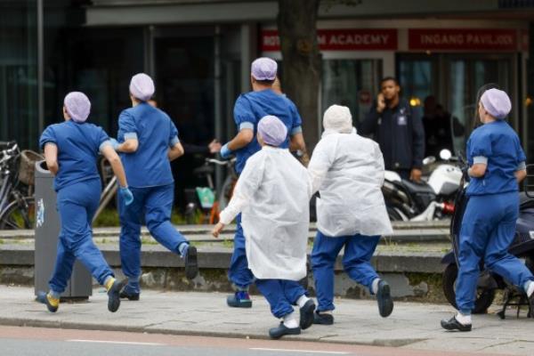 Mandatory Credit: Photo by Hollandse Hoogte/Shutterstock (14129995az) ROTTERDAM - Medical staff leave the Erasmus MC Rotterdam on Rochussenstraat, which has been cordo<em></em>ned off after two shooting incidents. Erasmus Mc Rotterdam Entrance on Rochussenstraat Closed Off, Police Report Shooting in the Area, Netherlands - 28 Sep 2023