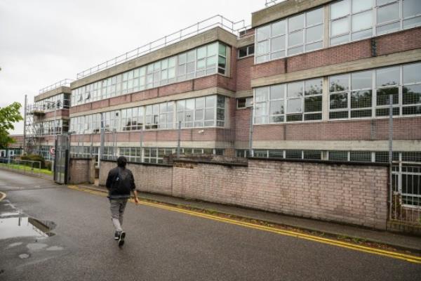 LONDON, ENGLAND - SEPTEMBER 01: In this general view, classroom buildings are seen as repair work co<em></em>ntinues at Hornsey School for Girls on September 01, 2023 in London, England. The school has rushed to reinforce a number of classroom ceilings after being notified of the potential collapse of structures using a certain type of aerated concrete. Over 100 schools across England have been told that they need to close buildings or implement emergency safety measures due to the use of reinforced autoclaved aerated co<em></em>ncrete (RAAC), a lightweight but less durable type of co<em></em>ncrete used extensively in the latter half of the 20th century. (Photo by Leon Neal/Getty Images)