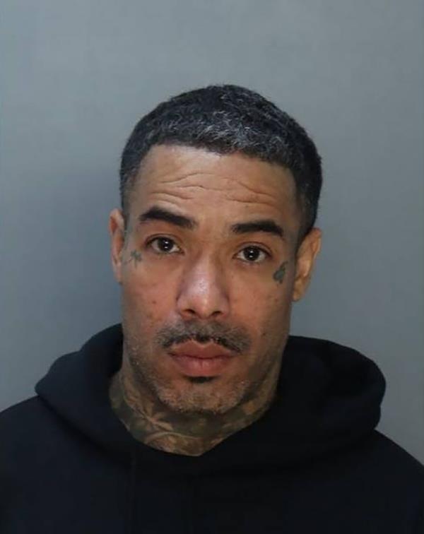 Rapper Gunplay, also known as Richard Morales Jr., 44, is pictured in a booking photo after his domestic violence arrest in Miami