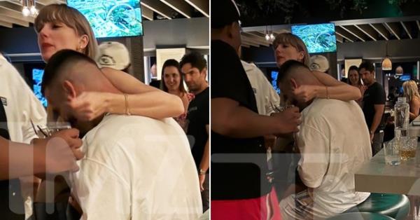 Taylor Swift hugging Travis Kelce