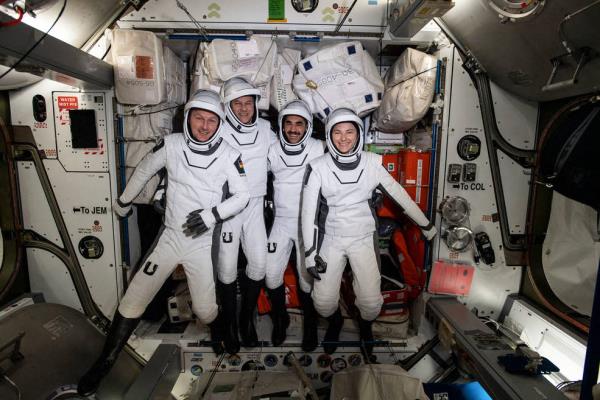 In this NASA handout picture the four commercial crew astro<em></em>nauts representing NASA's SpaceX Crew-3 mission (L-R) ESA (European Space Agency) astro<em></em>naut Matthias Maurer, and NASA astro<em></em>nauts Tom Marshburn, Raja Chari, and Kayla Barron, are pictured in their Dragon spacesuits for a fit check aboard the Internatio<em></em>nal Space Station's Harmony module on April 21. - Endurance is bringing Crew-3 back to Earth, including NASA astro<em></em>nauts Kayla Barron, Raja Chari, and Tom Marshburn, and ESA (European Space Agency) astro<em></em>naut Matthias Maurer, after a nearly six-mo<em></em>nth stay aboard the station. 