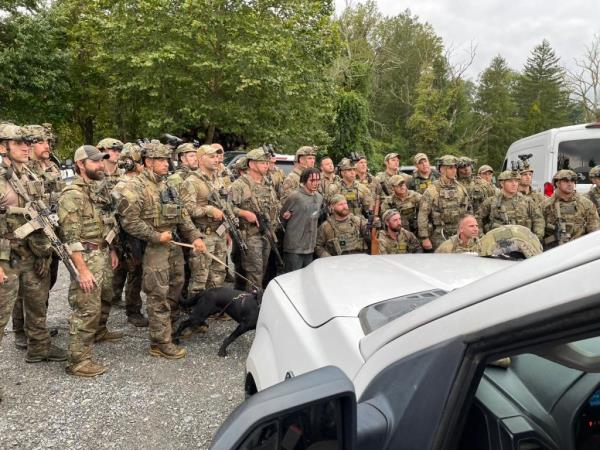 SWAT officers posed with Cavalcante after they captured him following a massive 14-day manhunt in Pennsylvania