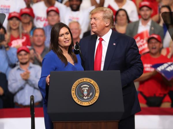 Sarah Huckabee Sanders and Do<em></em>nald Trump
