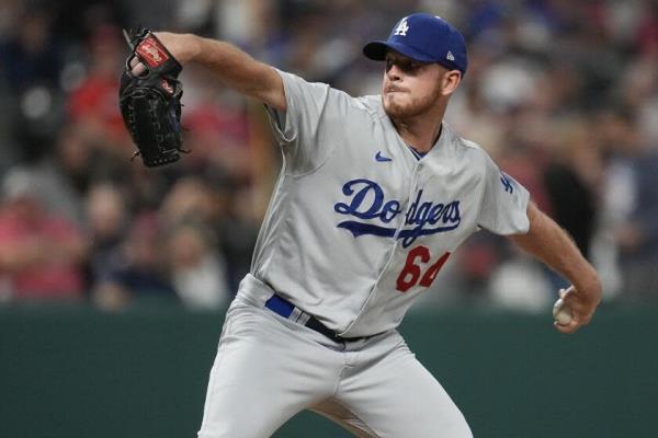 Los Angeles Dodgers' Caleb Ferguson pitches to a Cleveland Guardians batter during the seventh inning of a ba<em></em>seball game Tuesday, Aug. 22, 2023, in Cleveland. (AP Photo/Sue Ogrocki)
