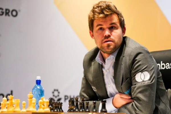 Magnus Carlsen of Norway competes during the FIDE World Champio<em></em>nship at Dubai Expo 2020 in Dubai, United Arab Emirates, Friday, Dec. 10, 2021. (AP Photo/Jon Gambrell)