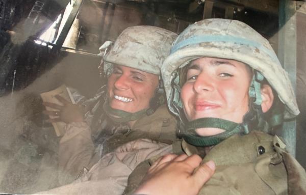 Amy Folwell, 37, from Rochester, New York, posing with another solider while on the Lio<em></em>ness team for the United States Marines Corps in 2007. 