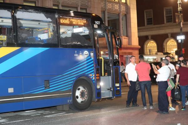 MTA bus with three shattered windows