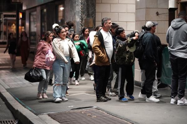 Apparent migrants and support perso<em></em>nnel seen outside of the Roosevelt Hotel in New York, NY on June 3, 2023. 