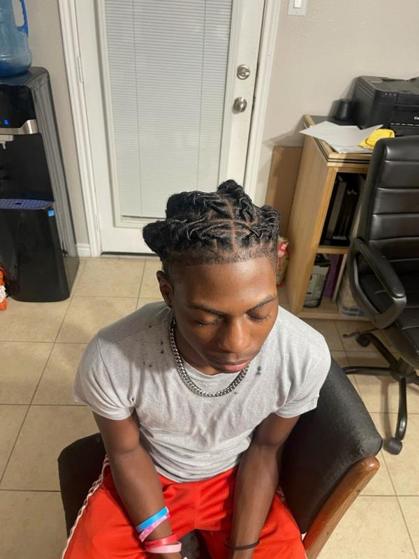 Darryl George, 17, a junior at Barbers Hill High School in Mont Belvieu, Texas, sits for a photo showing his locs on Sep. 10, 2023. 