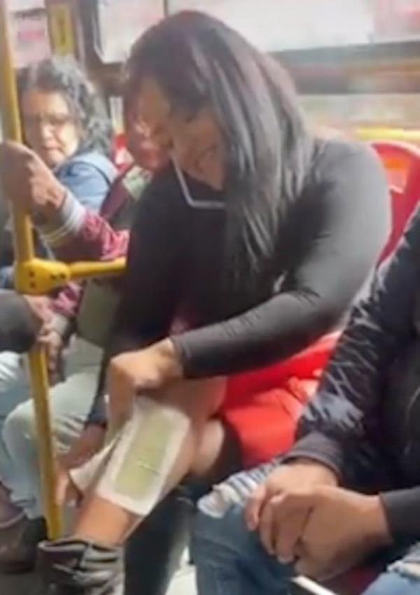 The woman on the bus waxing her legs