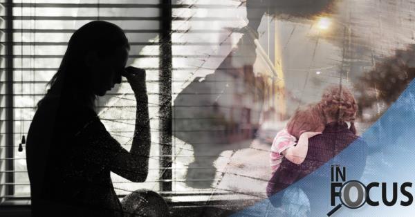 Stock image of woman holding her head, shadow, woman holding a child. 