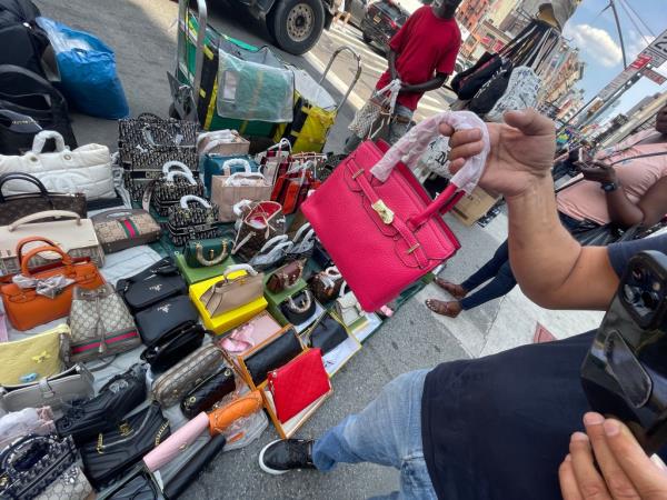 These knockoff handbags are being hawked on Canal Street.