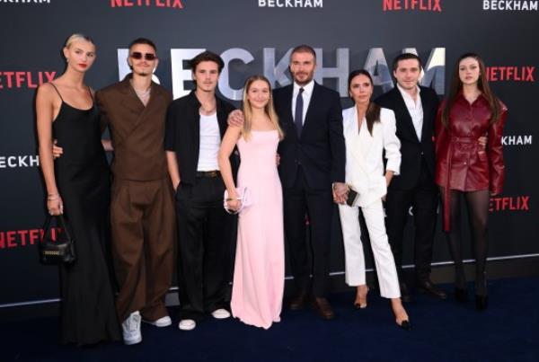 LONDON, ENGLAND - OCTOBER 03: (L-R) Mia Regan, Romeo Beckham, Cruz Beckham, Harper Beckham, David Beckham, Victoria Beckham, Brooklyn Beckham and Nicola Peltz attend the Netflix 'Beckham' UK Premiere at The Curzon Mayfair on October 03, 2023 in London, England. (Photo by Karwai Tang/WireImage)