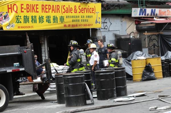 FDNY firefighters at the scene of a fire caused by e-bike batteries in Manhattan on June 21, 2023.