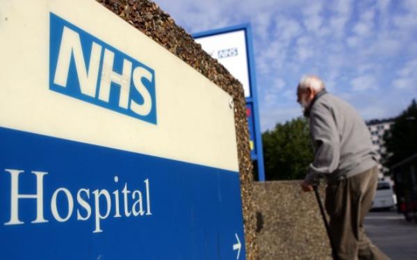 Lo<em></em>nDON - SEPTEMBER 26: An elderly gentleman walks past a hospital sign on September 26, 2007 in London, England. In a report to be released September 27, 2007 the Healthcare Commission outlines care by the NHS Trust should provide further dignity in care to the elderly. (Photo by Cate Gillon/Getty Images)