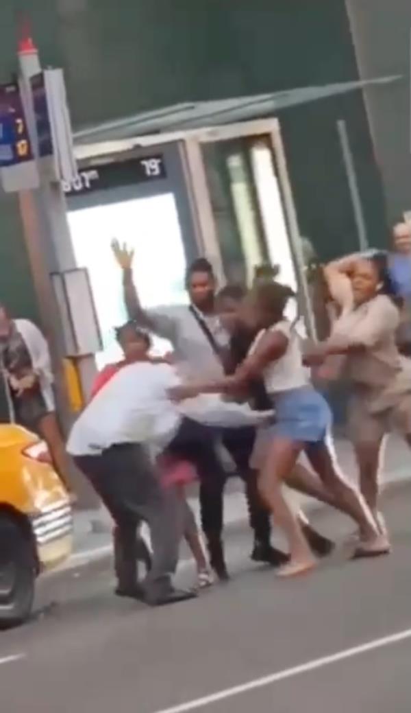Group attacks cab driver on street.