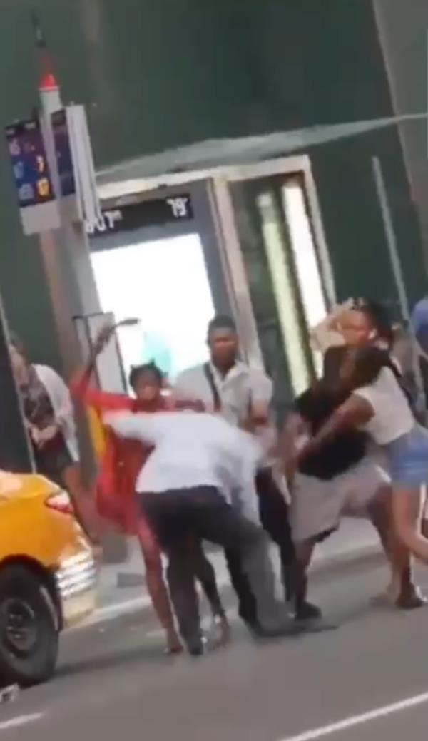 Group attacks cab driver on street.