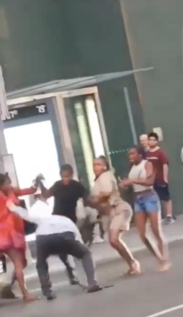Group attacks cab driver on street.