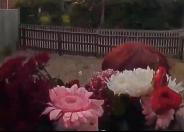 Clare Bailey with a bouquet of flowers 