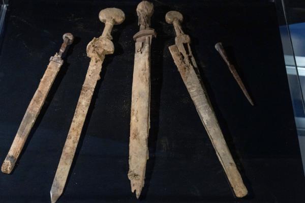 Israeli archaeologists show four Roman-era swords and a javelin head found during a recent excavation in a cave near the Dead Sea, in Jerusalem, Wednesday, Sep. 6, 2023.