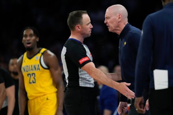 Indiana Pacers head coach Rick Carlisle, right, argues with a referee during the second half of Game 2 of the team's NBA basketball second-round playoff series against the New York Knicks, Wednesday, May 8, 2024