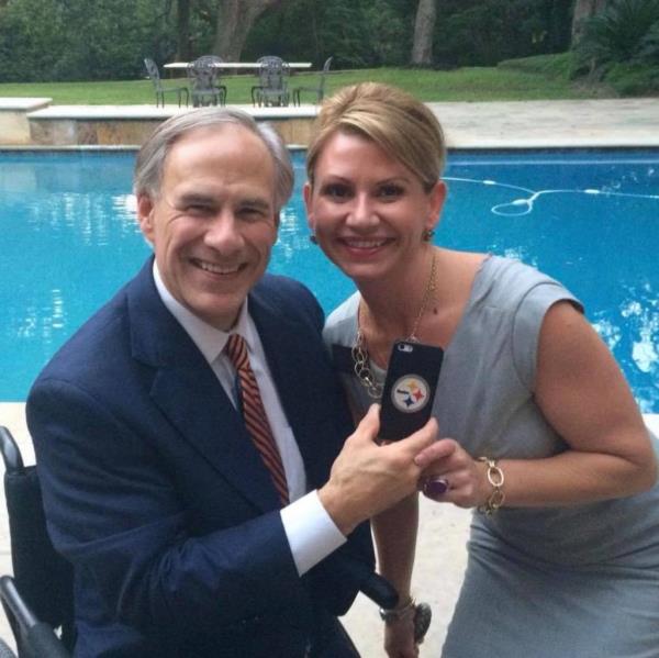Laura Olson posted this photo of herself with Texas. Gov. Greg Abbott to her Facebook profile in October 2020.