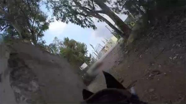 Body camera footage of one of the dogs on a raid.