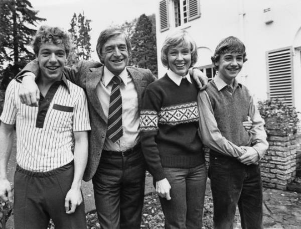 English broadcaster and talkshow host Michael Parkinson at home with his wife, TV presenter Mary Parkinson and their sons Nicholas (left) and Michael Jr. (right), England, 28th October 1980