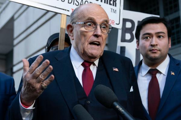 FILE - Former New York Mayor Rudy Giuliani speaks during a news co<em></em>nference outside the federal courthouse in Washington, Friday, Dec. 15, 2023.