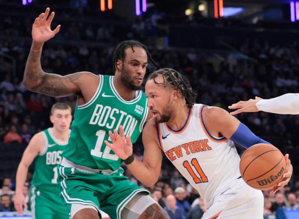 Jalen Brunson drives on Oshae Brissett during the Knicks' 114-107 preseason win over the Celtics.