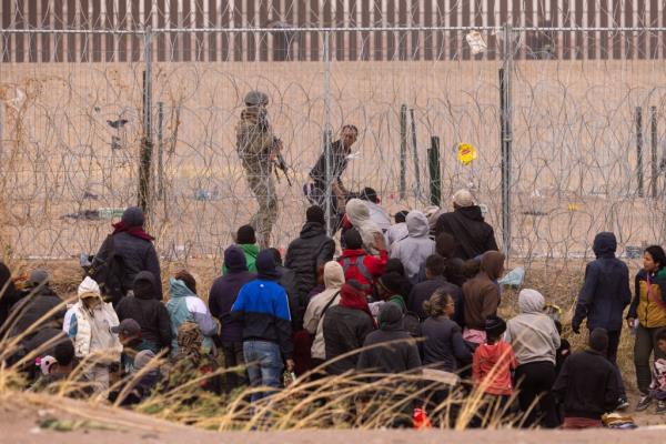 Texas Natio<em></em>nal Guard troops push back migrants who've crossed into the US from Mexico