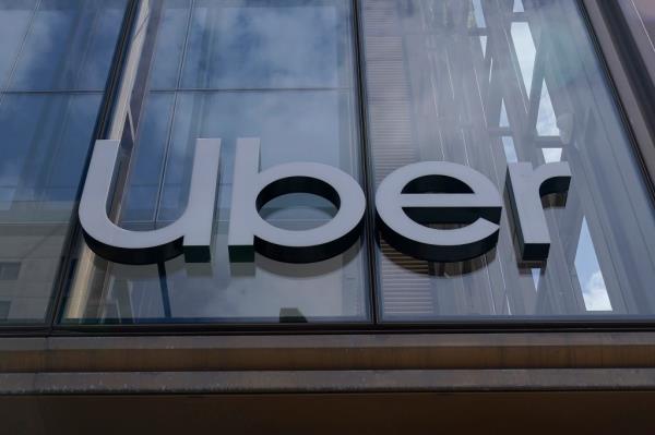 Uber sign displayed at company headquarters with announcement of Uber and Lyft delaying plan stoppage in Minneapolis due to ordinance delay
