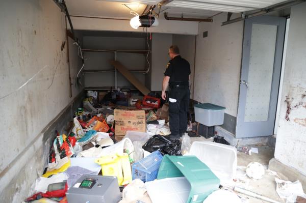a pile of junk left behind in the friendly lane home after accused squatters Barry and Barbara Pollack finally vacated