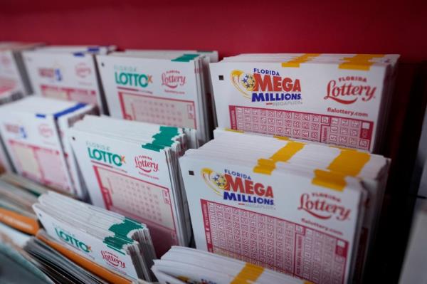 Lottery forms are seen, Aug. 7, 2023, at the Presidente Supermarket in the Little Havana neighborhood of Miami. Officials said on Wednesday, Sept. 27, that the winner of the $1.6 billion Mega Millions jackpot in August has come forward to claim the prize.