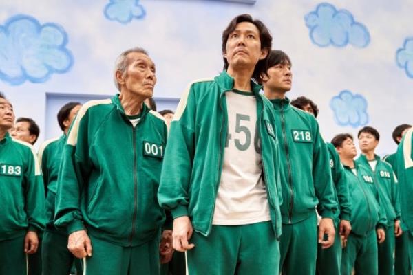 Lee Jung-jae, center, Park Hae-soo, right, and Oh Yeong-soo in a scene from Squid Game. 