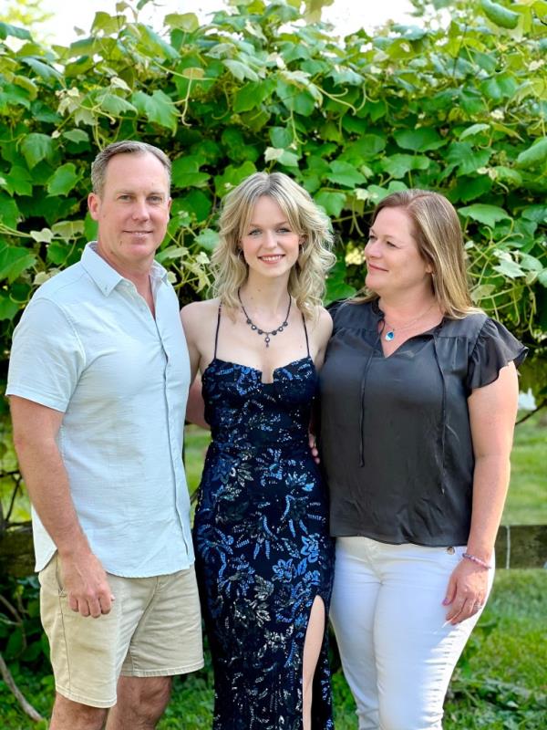 Jillian Ludwig, center, with her parents, Matt and Jessica.