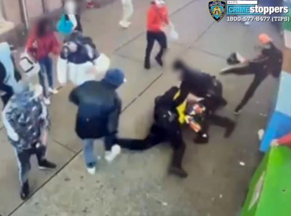 Shocking video captured the moment a migrant mob pounded a pair of cops near Times Square 