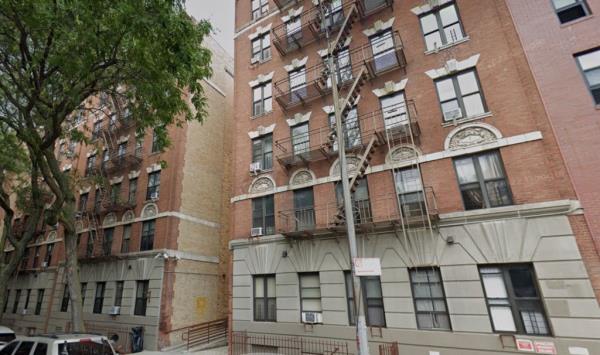brick exterior of 15 albany ave in bedford stuyvesant wher<em></em>e two men were shot at this Brooklyn building early Saturday. Both survived. 